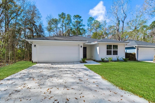 ranch-style home featuring a garage and a front yard