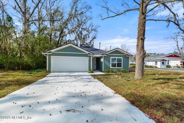 ranch-style house featuring a garage, concrete driveway, and a front lawn