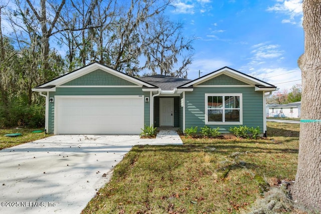 view of front of property with an attached garage, a front lawn, and concrete driveway