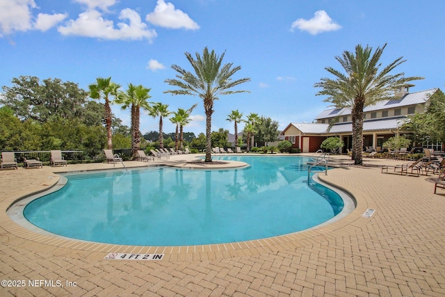 pool featuring a patio area