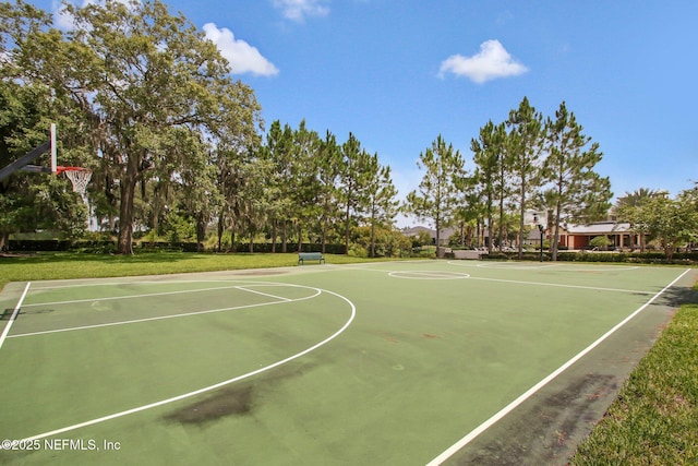 view of basketball court featuring community basketball court and a yard