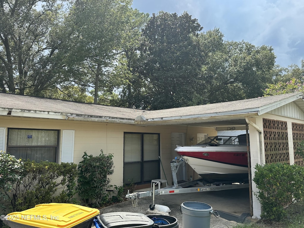 view of home's exterior featuring a carport