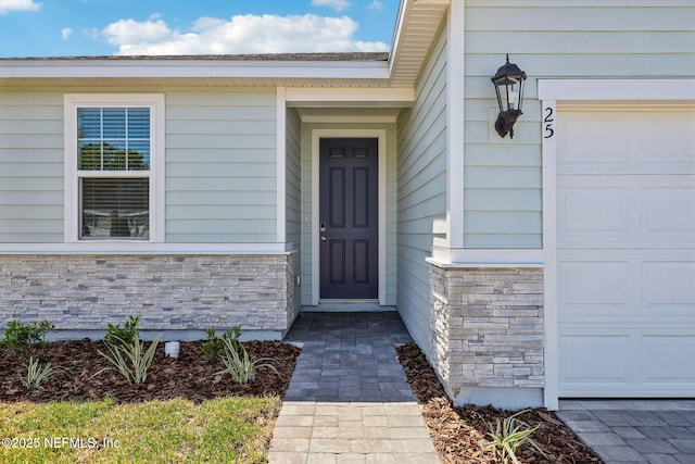 25 Ararat Dr, Palm Coast, FL 32137 - entrance to property with stone siding