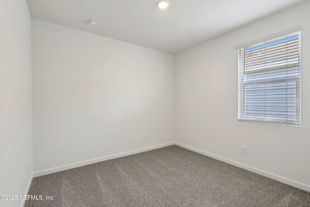 25 Ararat Dr, Palm Coast, FL 32137 - carpeted empty room featuring baseboards