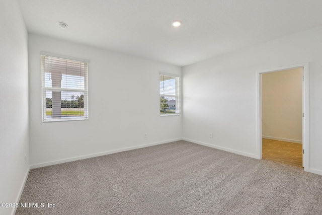 25 Ararat Dr, Palm Coast, FL 32137 - spare room with recessed lighting, carpet flooring, and baseboards