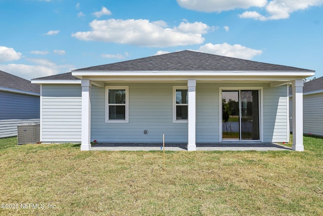 25 Ararat Dr, Palm Coast, FL 32137 - back of property featuring a yard and a shingled roof