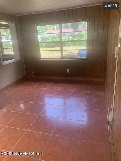 spare room featuring tile patterned flooring