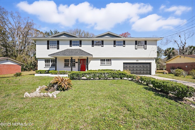 view of front of home featuring a garage and a front lawn