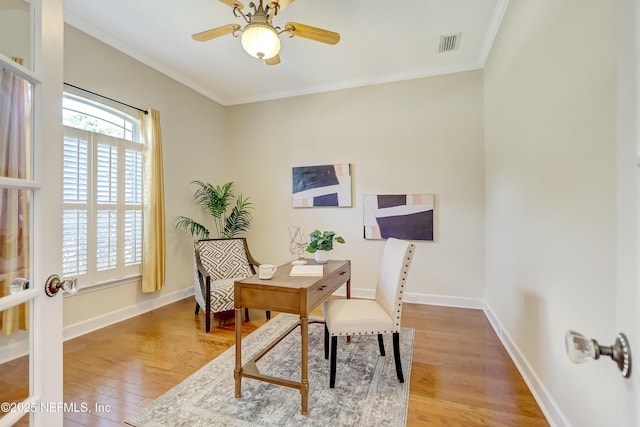 office area with ornamental molding, hardwood / wood-style floors, and ceiling fan