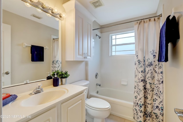 full bathroom featuring vanity, shower / bath combo, and toilet