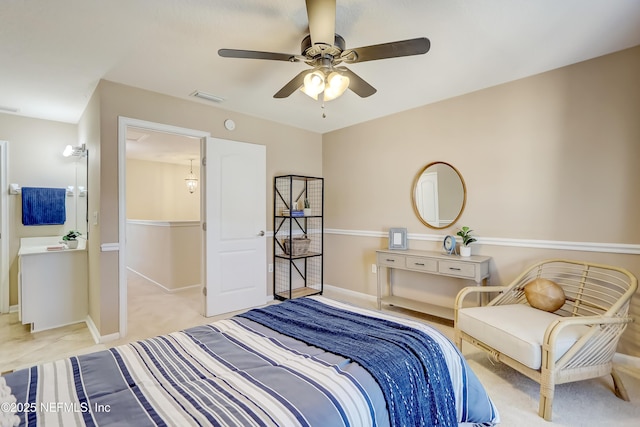 bedroom with light carpet and ceiling fan