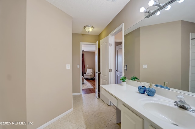 bathroom with tile patterned floors and vanity