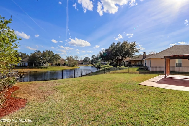 view of yard with a patio and a water view