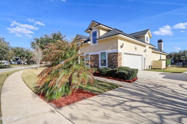 view of side of property with a garage