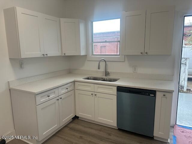 939 Jasmine Pl, Jacksonville, FL 32205 - kitchen with white cabinetry, sink, dark wood-type flooring, and dishwasher