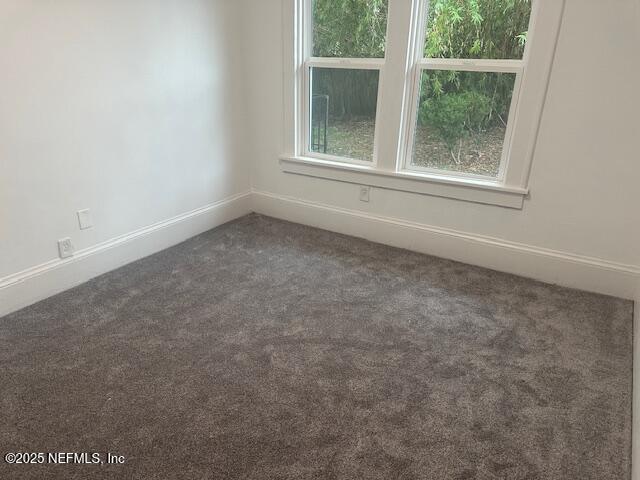 939 Jasmine Pl, Jacksonville, FL 32205 - unfurnished room featuring dark colored carpet