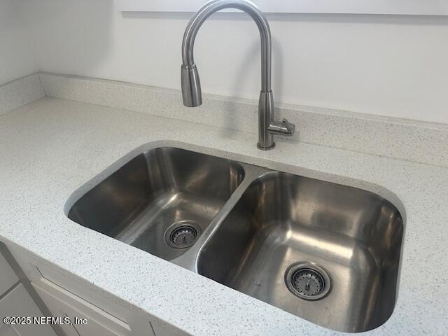 939 Jasmine Pl, Jacksonville, FL 32205 - room details featuring sink and light stone countertops