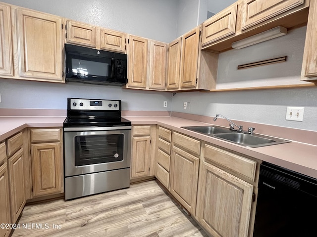 kitchen with light brown cabinetry, sink, light hardwood / wood-style flooring, and black appliances