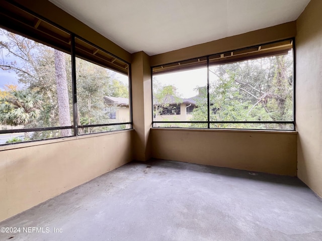 unfurnished sunroom with a wealth of natural light