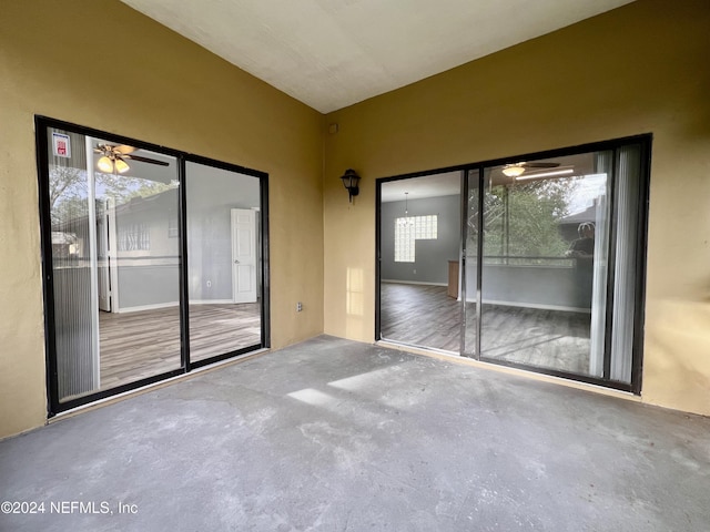 interior space with ceiling fan