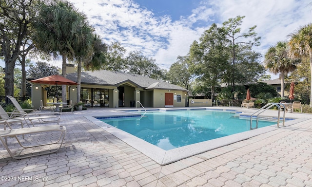 view of pool featuring a patio