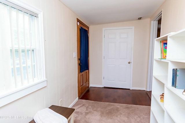 corridor featuring dark hardwood / wood-style floors