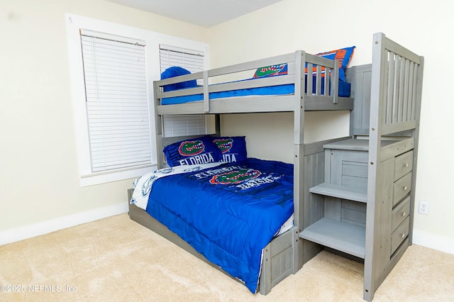 bedroom featuring light colored carpet