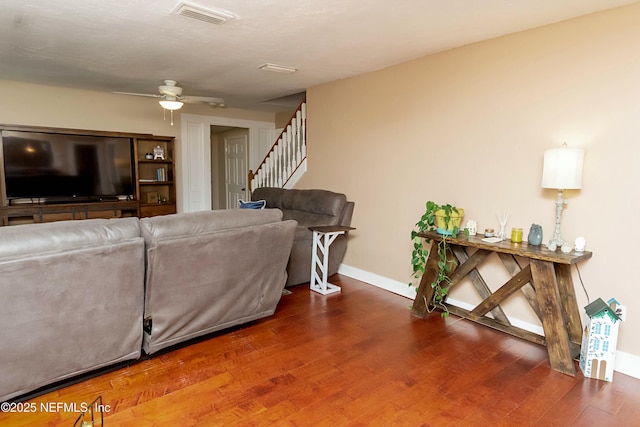 living room featuring hardwood / wood-style flooring and ceiling fan