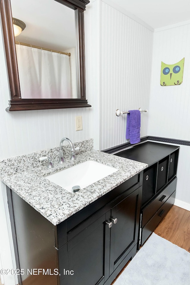 bathroom featuring vanity and hardwood / wood-style floors