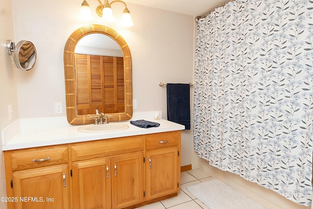 bathroom featuring tile patterned flooring and vanity