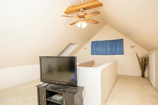 interior space featuring vaulted ceiling and ceiling fan