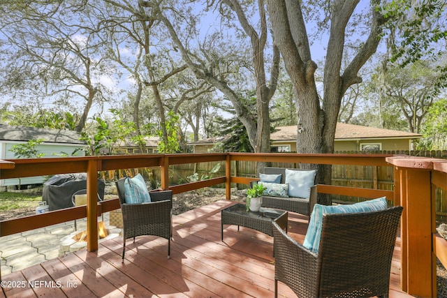 wooden terrace with outdoor lounge area