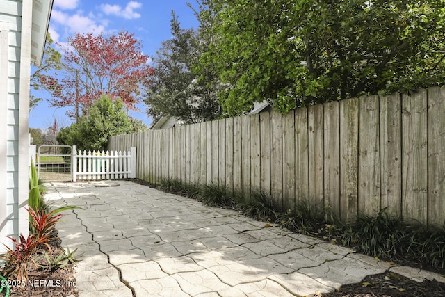 view of patio / terrace featuring fence