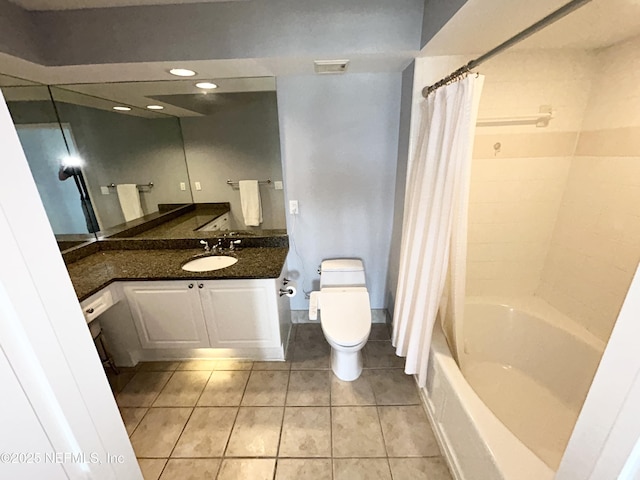 full bathroom with tile patterned flooring, vanity, shower / tub combo with curtain, and toilet