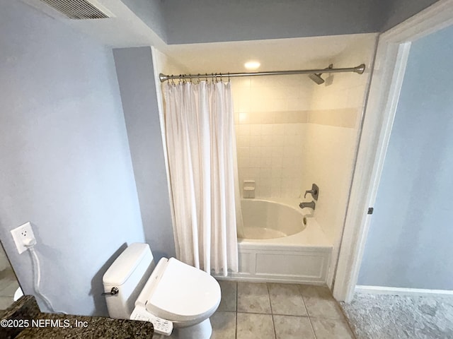 bathroom with tile patterned flooring, toilet, and shower / bath combo with shower curtain