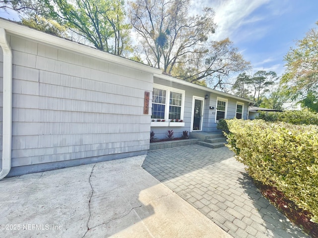 doorway to property featuring a patio area