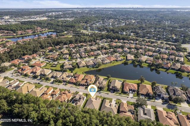 drone / aerial view with a water view