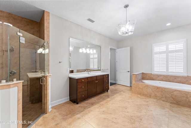 bathroom featuring vanity, plus walk in shower, and a chandelier