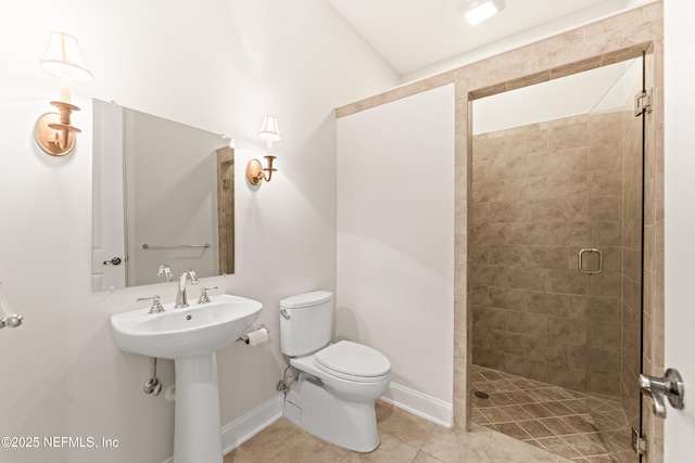 bathroom featuring sink, toilet, tile patterned flooring, and a shower with door