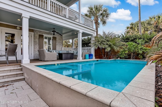 view of pool featuring an outdoor hangout area and ceiling fan