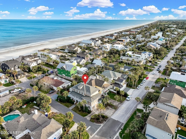 aerial view featuring a water view and a view of the beach