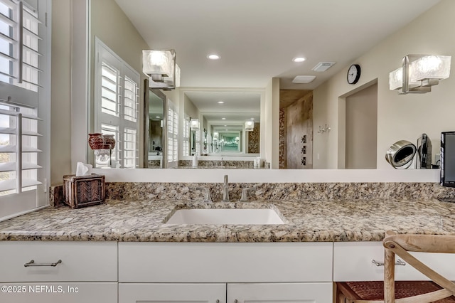 bathroom with vanity and walk in shower