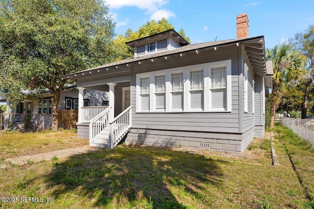 bungalow with a front lawn