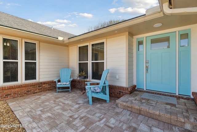 property entrance with a patio