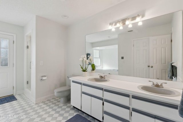 bathroom with toilet and vanity