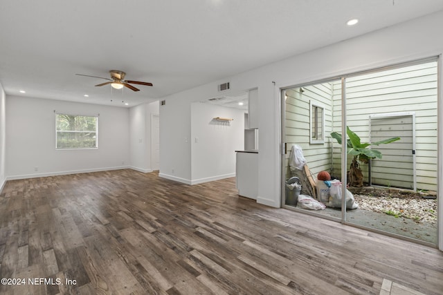 empty room with baseboards, visible vents, ceiling fan, wood finished floors, and recessed lighting