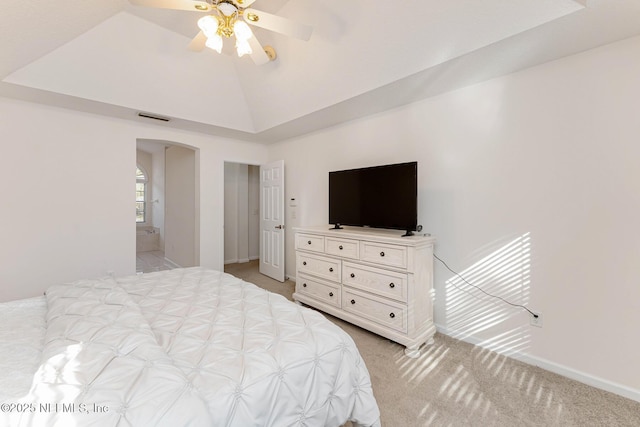 bedroom featuring arched walkways, lofted ceiling, visible vents, light carpet, and baseboards