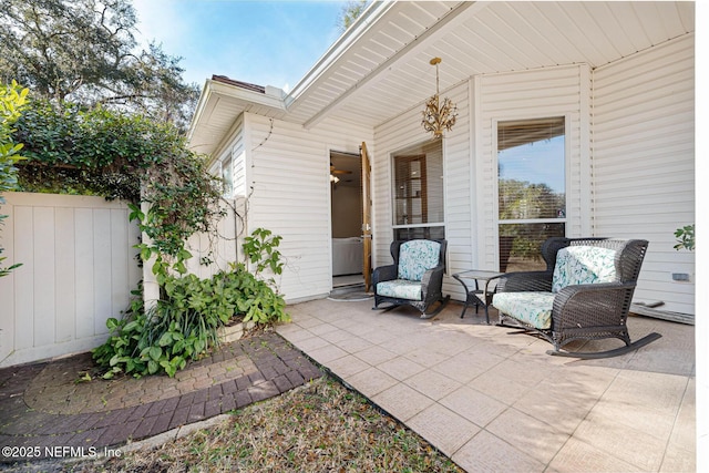 view of patio / terrace featuring fence