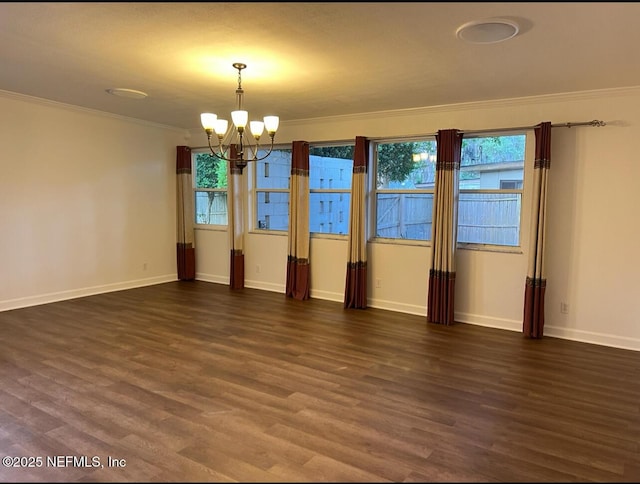 816 Middleton Rd, Jacksonville, FL 32211 - empty room with a chandelier, dark wood finished floors, ornamental molding, and healthy amount of natural light