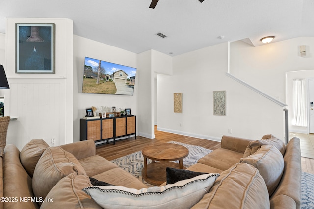 living room with ceiling fan and hardwood / wood-style floors